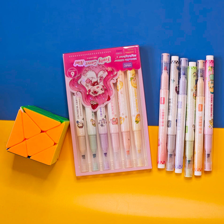 Set of 6 colorful metallic glitter highlighter pens for kids, packaged in two pastel-themed boxes labeled “Fruity Sweet Mix.” Each pen features cute cartoon character prints and soft, vibrant ink colors perfect for journaling, school projects, or creative doodling. The packaging is designed with anime-style illustrations of girls in whimsical outfits, appealing to children and stationery lovers. Displayed on a dual-tone yellow and blue background, this pen set makes a fun and eye-catching gift for birthdays